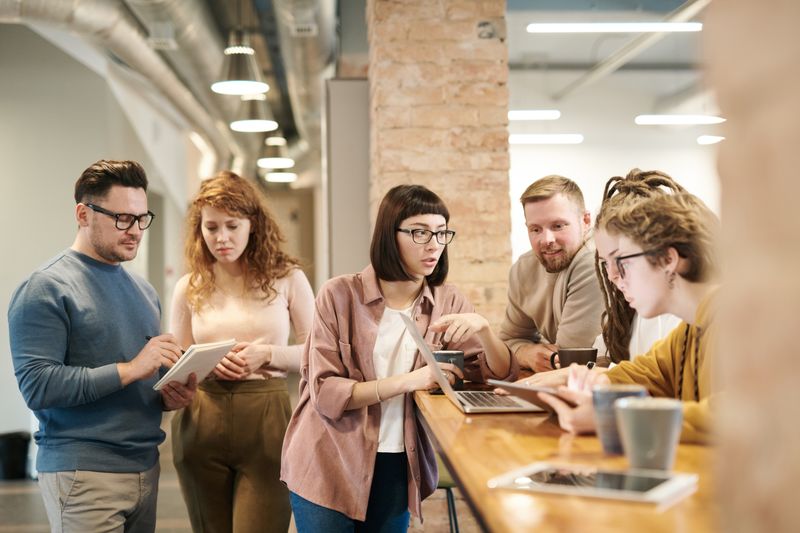 Diverse team collaborating in a modern workplace